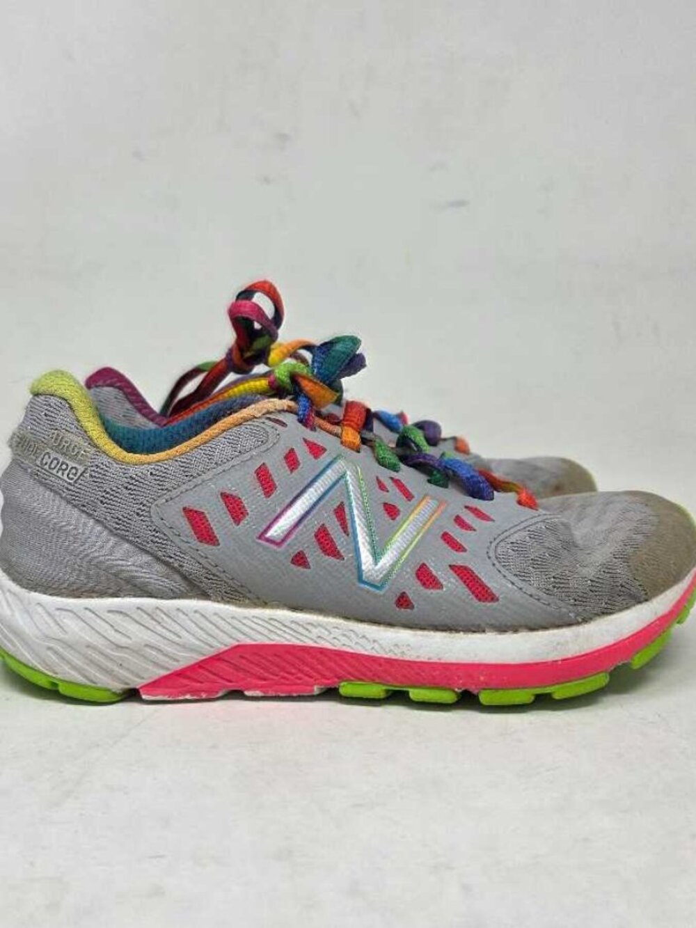 Girl's 10.5 New Balance Fuel Core Urge rainbow sneakers  * Need insoles *